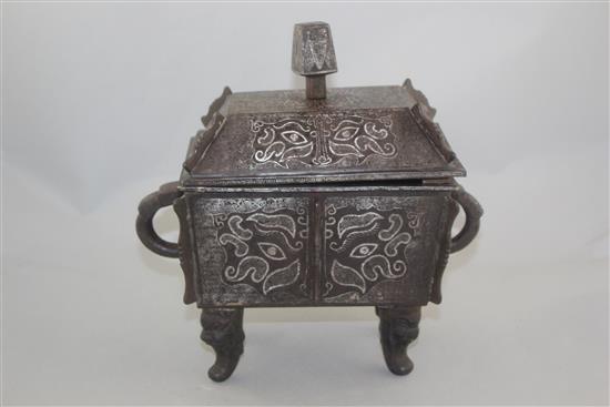 A Chinese iron and silver overlaid vessel and cover, Fangding, probably 19th century, 27.5cm